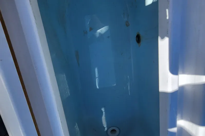 Slide: The Image of Interior view of a 2018 Sportsman Masters 247 Bay Boat compartment. - 15