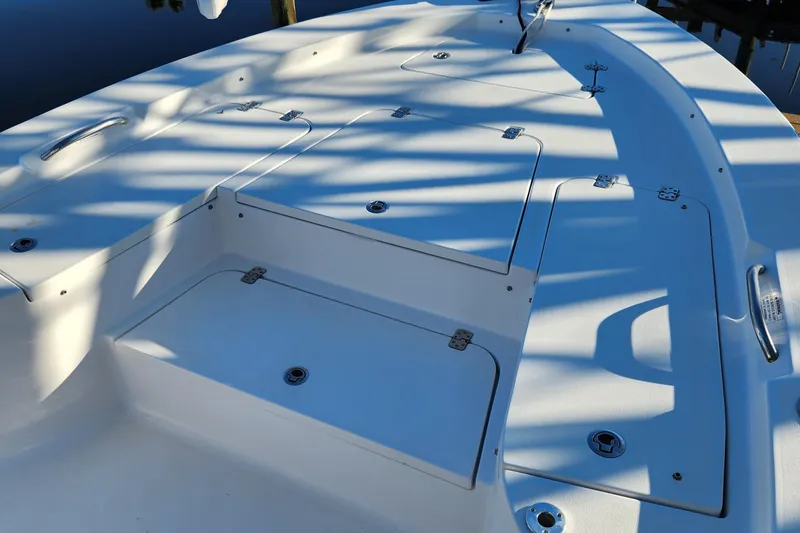 Slide: The Image of 2018 Sportsman Masters 247 Bay Boat deck with storage compartments and sleek design. - 26