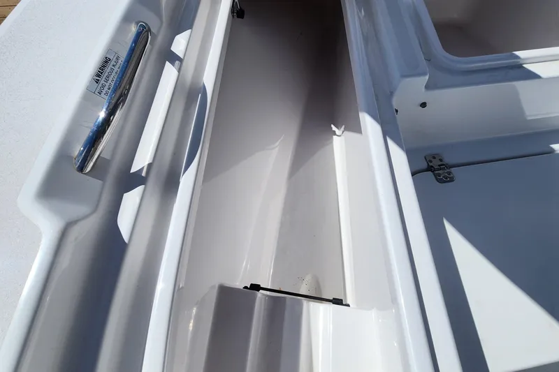 Slide: The Image of 2018 Sportsman Masters 247 Bay Boat storage compartment with stainless steel handle. - 7