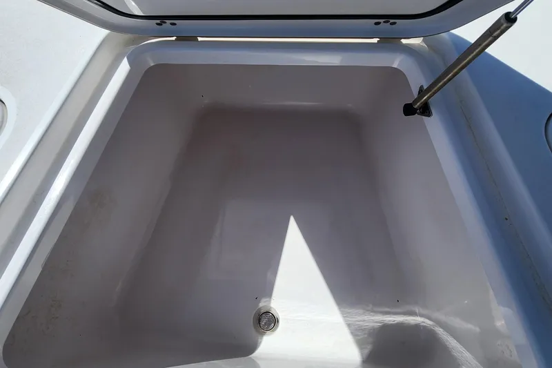 Slide: The Image of Open storage compartment on 2018 Sportsman Masters 247 Bay Boat. - 9