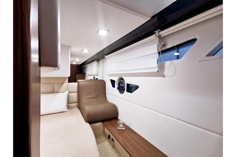 Slide: The Image of Luxurious interior of 2026 Cobrey 28 SC yacht with modern seating and elegant design. - 9