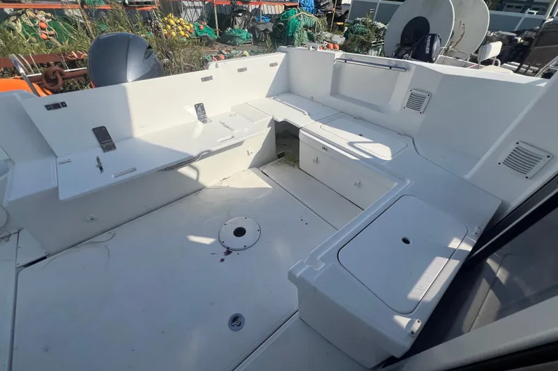 Slide: The Image of 2020 Jeanneau NC Sport 795 boat deck with seating and storage compartments. - 12