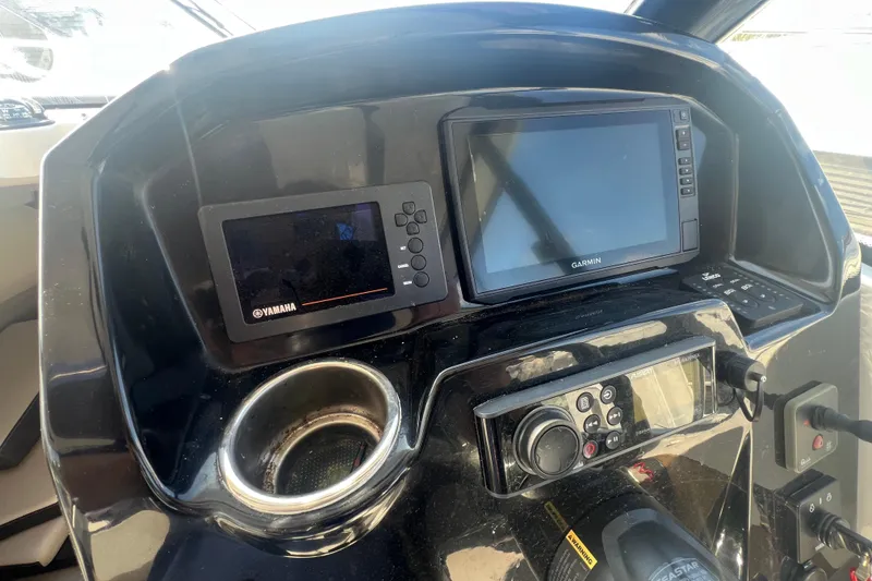 Slide: The Image of Control panel of 2020 Jeanneau NC Sport 795 with Garmin and Yamaha displays. - 5