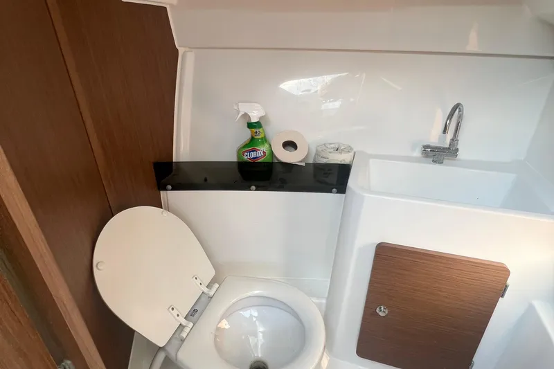 Slide: The Image of Bathroom interior of 2020 Jeanneau NC Sport 795 boat with toilet and sink. - 6