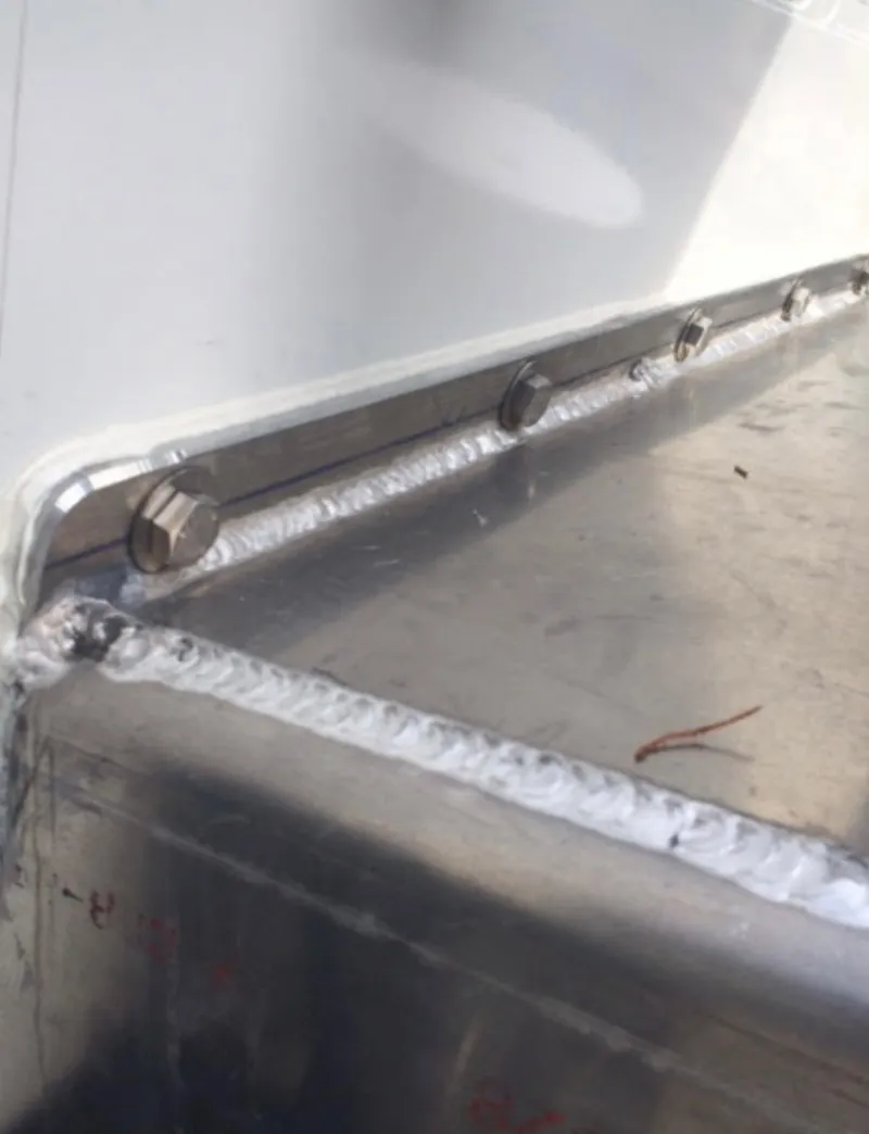 Slide: The Image of Close-up of welded metal joint on a 2001 Willard 25 boat. - 12