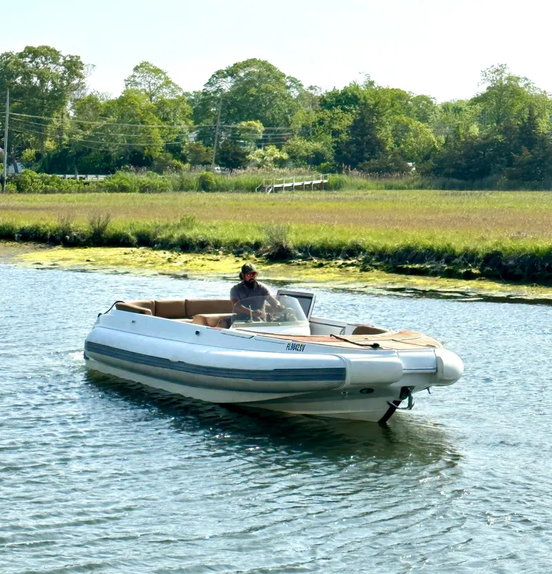 The Image of 2008 Castoldi Jet Tender 23 boat cruising on a calm river. - 0