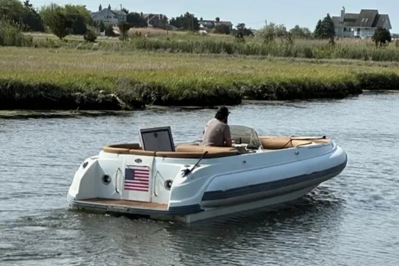 Slide: The Image of 2008 Castoldi Jet Tender 23 cruising on a calm river with scenic background. - 4