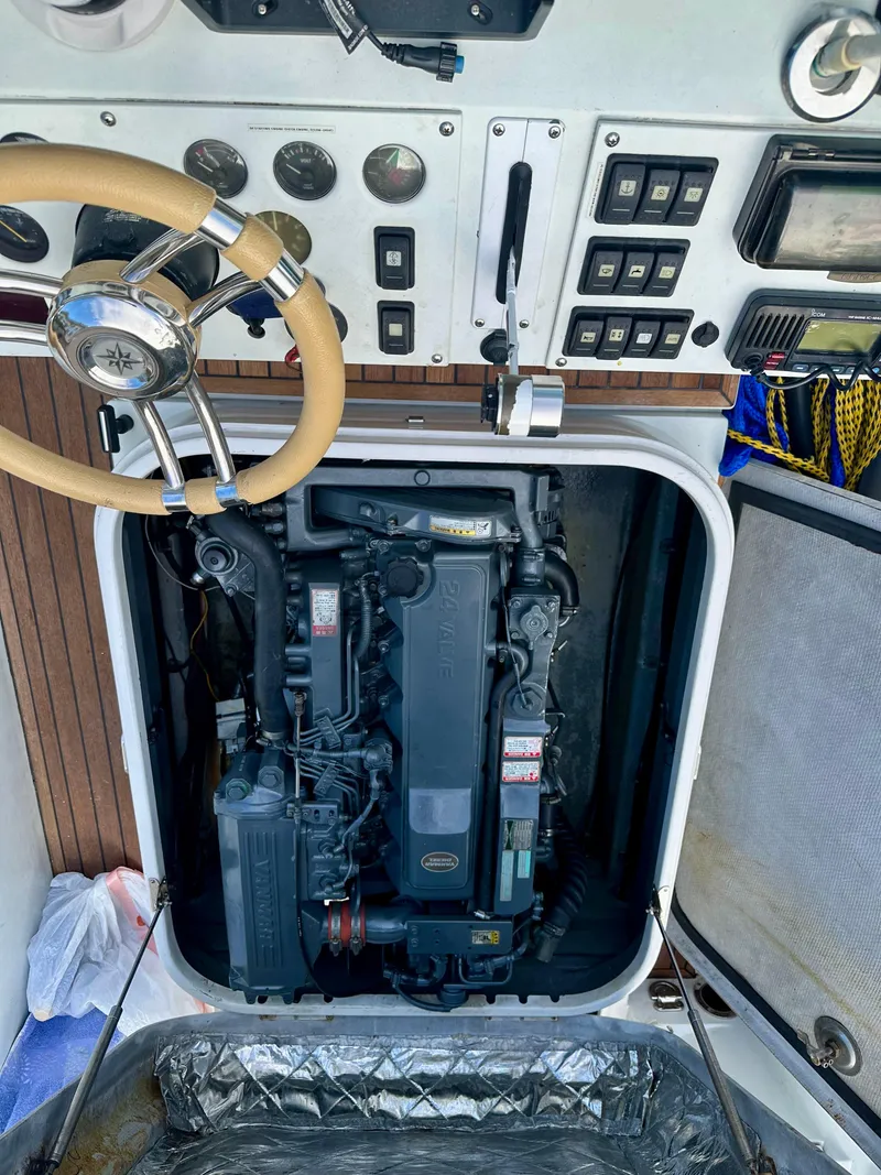 Slide: The Image of 2008 Castoldi Jet Tender 23 engine compartment with control panel and steering wheel. - 8