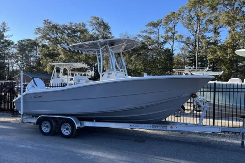 Slide: The Image of 2026 Bulls Bay 230 Center Console boat on trailer, parked outdoors. - 7