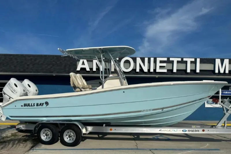 The Image of 2026 Bulls Bay 255CC boat on trailer, displayed outside dealership. - 0