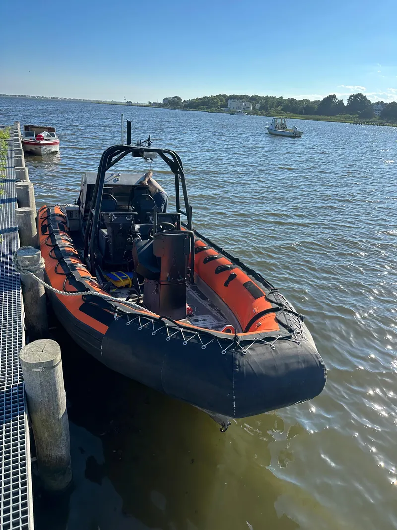 The Image of 2008 Zodiac 24 boat docked by the water on a sunny day. - 0
