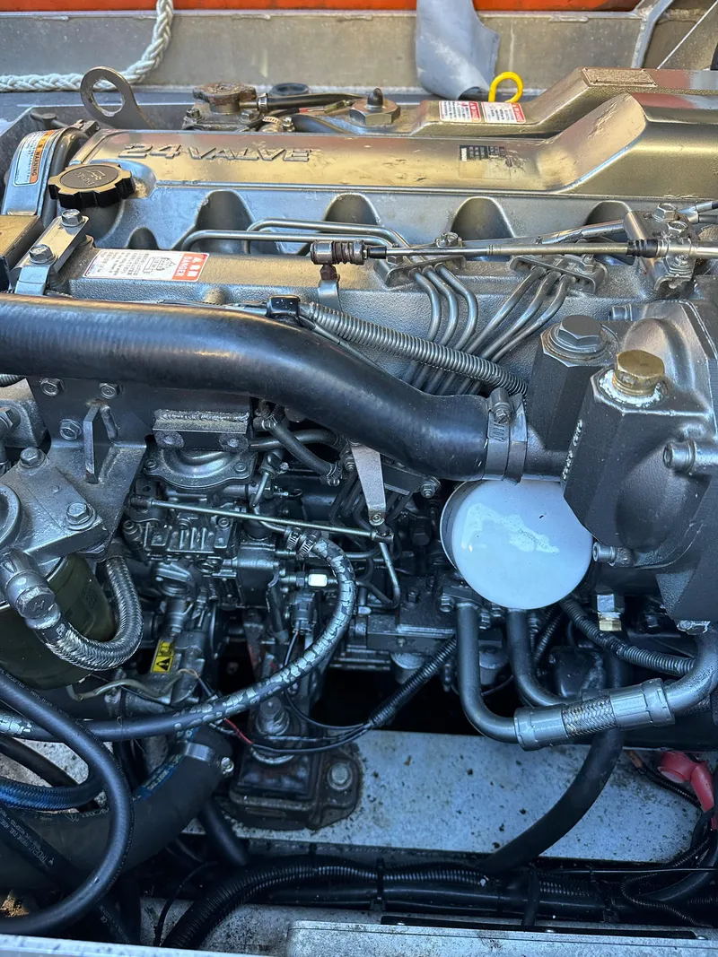 Slide: The Image of 2008 Zodiac 24 engine close-up, showcasing intricate mechanical components and wiring. - 10