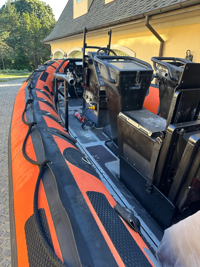 Slide: The Image of Alt text: 2008 Zodiac 24 inflatable boat with orange and black detailing. - 11
