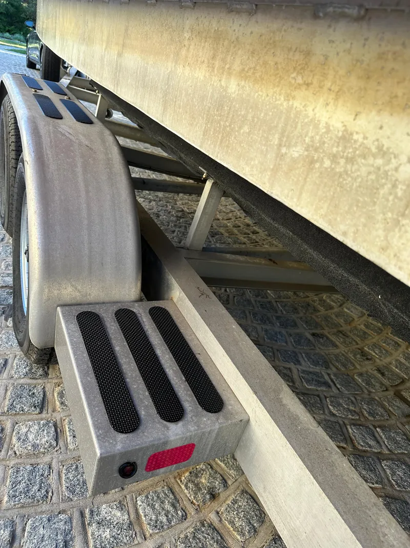 Slide: The Image of Close-up of a Zodiac 24 boat trailer, 2008 model, on cobblestone pavement. - 12