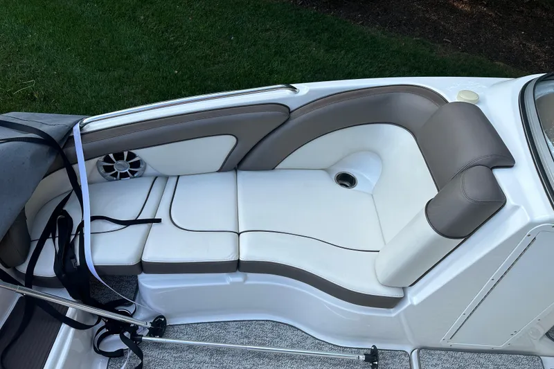 Slide: The Image of 2012 Yamaha Boats 242 Limited S interior seating with white and brown upholstery. - 10