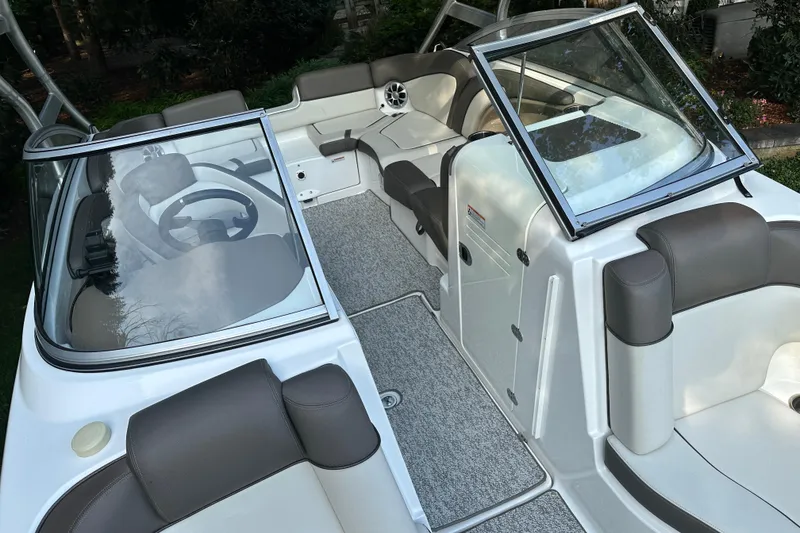 Slide: The Image of 2012 Yamaha Boats 242 Limited S interior with seating and steering wheel, showcasing luxury design. - 12