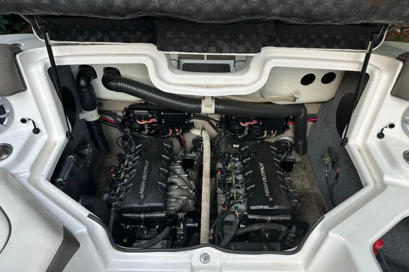 Slide: The Image of Engine compartment of 2012 Yamaha Boats 242 Limited S, showcasing dual high-output engines. - 17