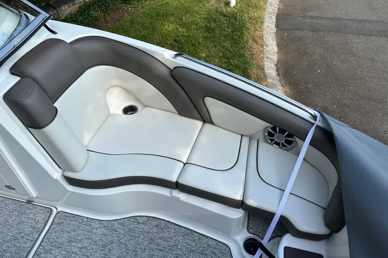 Slide: The Image of 2012 Yamaha Boats 242 Limited S interior seating with speaker and cup holder. - 9