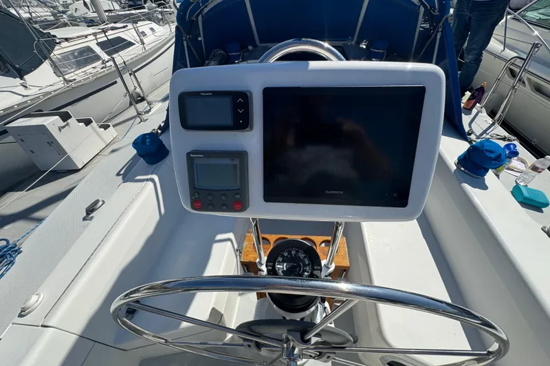 Slide: The Image of Steering console of a 1994 Catalina 320 sailboat with navigation instruments. - 15
