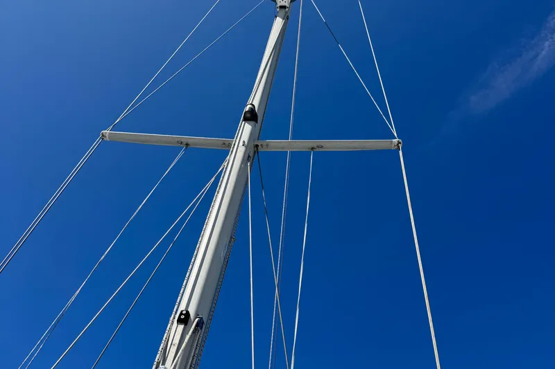 Slide: The Image of Mast of 1994 Catalina 320 sailboat against clear blue sky. - 55