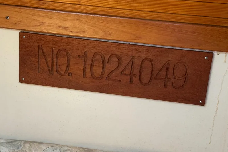 Slide: The Image of Wooden plaque with engraved number 1024049 on a Catalina 320, 1994 model. - 56
