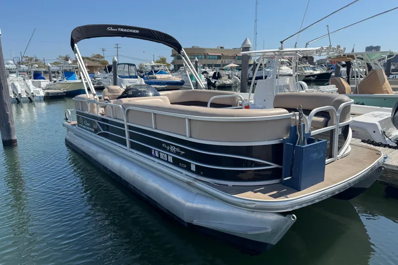 The Image of 2017 Sun Tracker Party Barge 22 DLX pontoon boat docked at marina. - 0