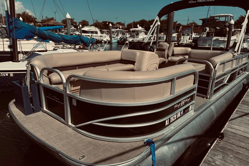 Slide: The Image of 2017 Sun Tracker Party Barge 22 DLX pontoon boat docked at marina. - 12