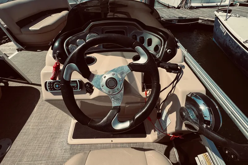 Slide: The Image of Steering console of a 2017 Sun Tracker Party Barge 22 DLX pontoon boat. - 9
