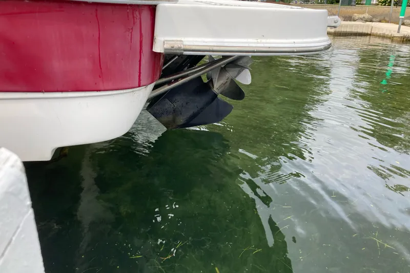 Slide: The Image of 2005 Ebbtide 2400 Fun Cruiser DC boat propeller in clear water. - 3