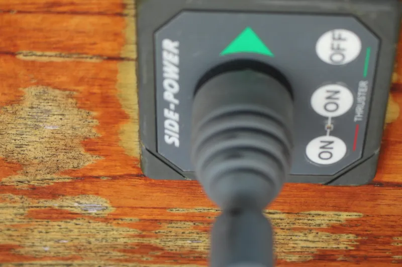 Slide: The Image of Side-Power thruster control on 1981 Hardin 45 Voyager boat, mounted on weathered wood. - 17