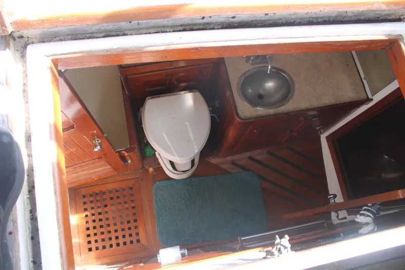 Slide: The Image of 1981 Hardin 45 Voyager yacht bathroom with wooden cabinetry and compact sink. - 19