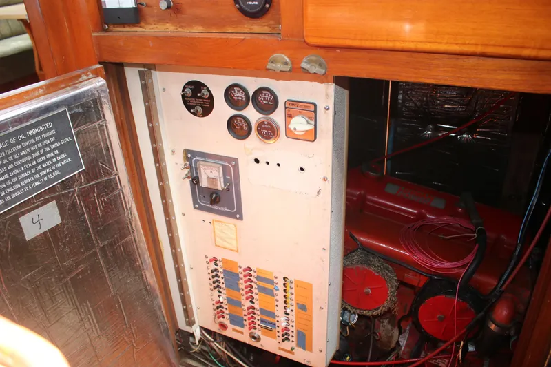 Slide: The Image of Control panel and engine of 1981 Hardin 45 Voyager sailboat, featuring gauges and wiring. - 20