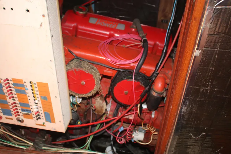 Slide: The Image of Engine compartment of a 1981 Hardin 45 Voyager with visible wiring and components. - 25