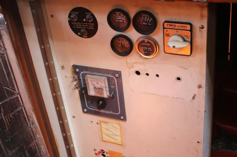 Slide: The Image of Control panel of a 1981 Hardin 45 Voyager boat with gauges and switches. - 26