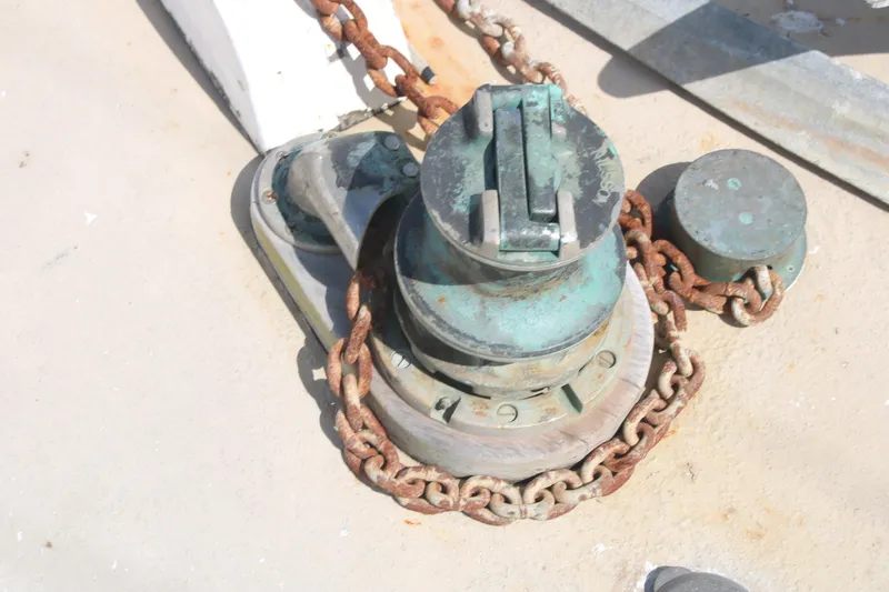 Slide: The Image of Rusty anchor windlass on 1981 Hardin 45 Voyager sailboat deck. - 31