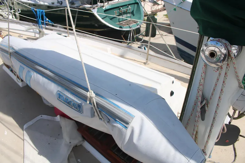 Slide: The Image of 1981 Hardin 45 Voyager sailboat deck with covered equipment and rigging. - 32