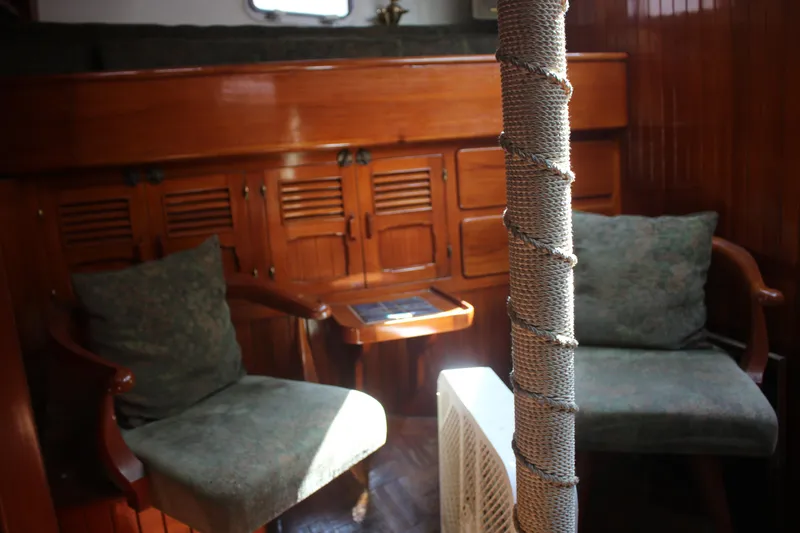 Slide: The Image of Interior of 1981 Hardin 45 Voyager yacht with wooden furniture and cozy seating. - 34