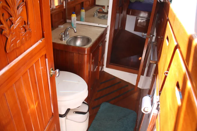 Slide: The Image of Wood-paneled bathroom in 1981 Hardin 45 Voyager yacht with sink and toilet. - 37