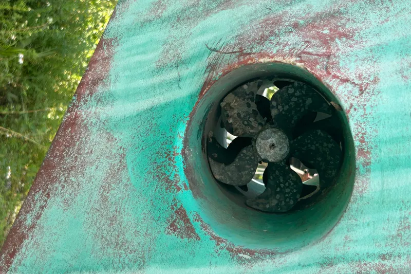 Slide: The Image of Close-up of a weathered 1981 Hardin 45 Voyager boat propeller. - 4