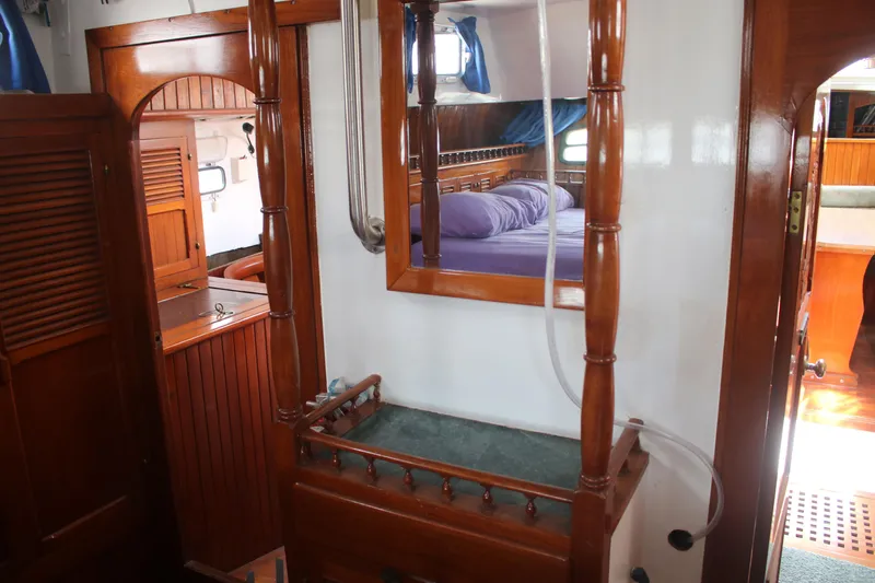 Slide: The Image of Interior of 1981 Hardin 45 Voyager yacht with wooden finishes and cozy cabin. - 40
