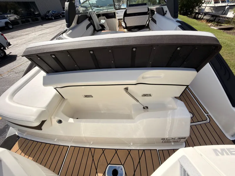 Slide: The Image of The image shows the stern of a Sea Ray SLX 280 Outboard with an open storage hatch. - 21