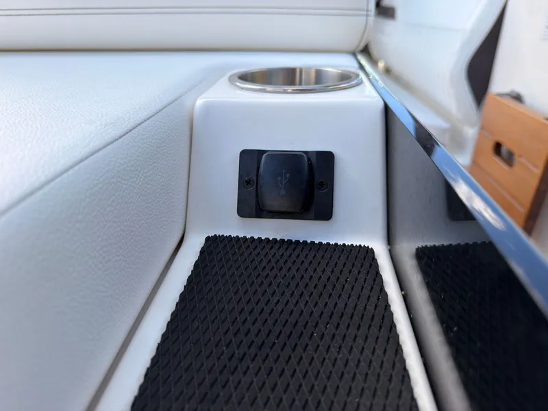 Slide: The Image of Close-up of a USB port next to a cup holder on a boat. - 28