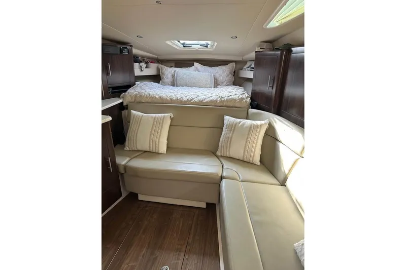 Slide: The Image of Interior of 2016 Regal 35 Sport Coupe with cozy seating and bed. - 12