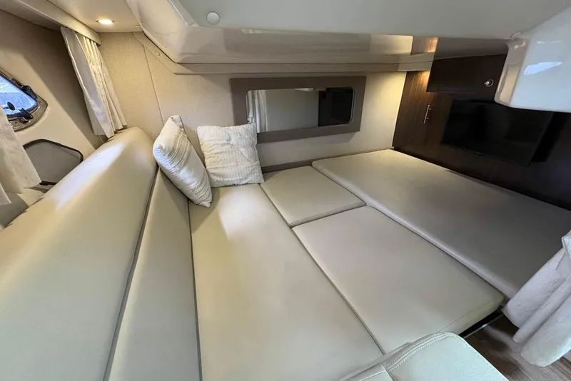 Slide: The Image of Interior of 2016 Regal 35 Sport Coupe with beige seating and modern design. - 13