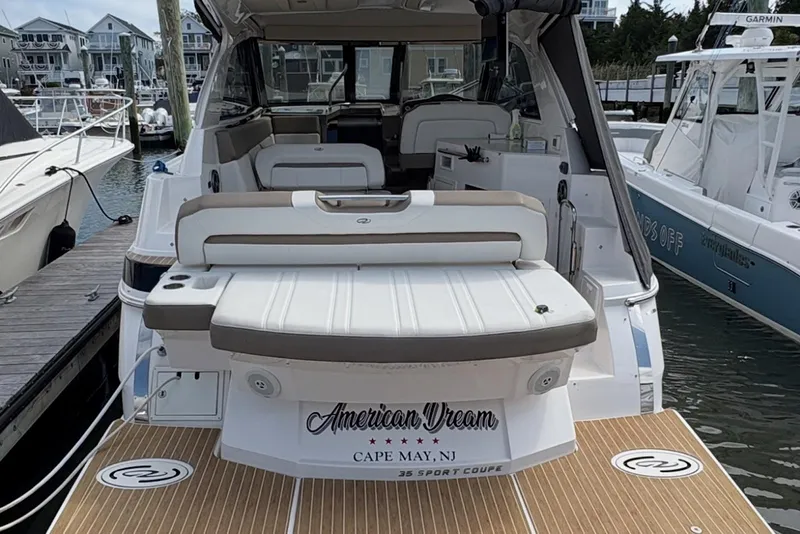 Slide: The Image of 2016 Regal 35 Sport Coupe docked, featuring spacious seating and "American Dream" branding. - 5