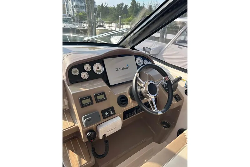 Slide: The Image of 2016 Regal 35 Sport Coupe helm with Garmin navigation system and modern controls. - 8