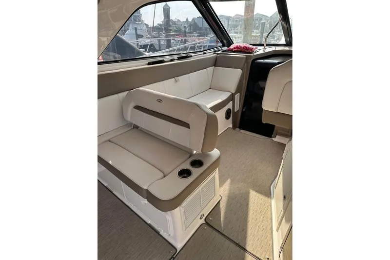 Slide: The Image of Interior of 2016 Regal 35 Sport Coupe with beige seating and cup holders. - 9