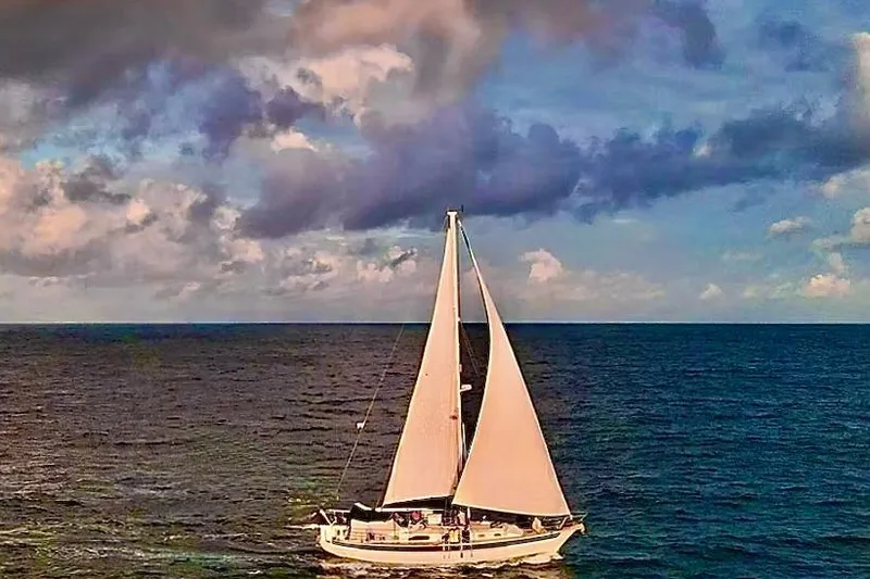 The Image of Sailboat on open sea under cloudy sky, Passport 42 model, 1986. - 0