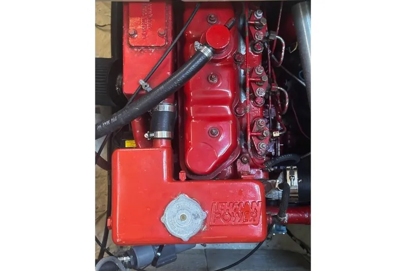 Slide: The Image of Red Lehman Power engine in a 1986 Passport 42 model boat. - 22