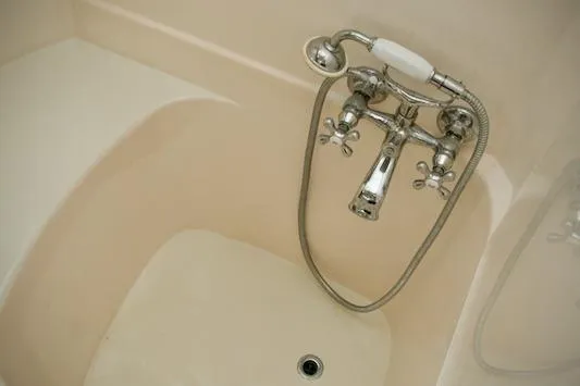Slide: The Image of Vintage bathtub with chrome faucet and showerhead, Passport model 42, 1986. - 29
